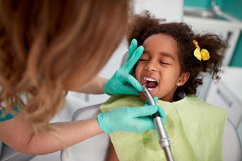 Child receives dental treatment